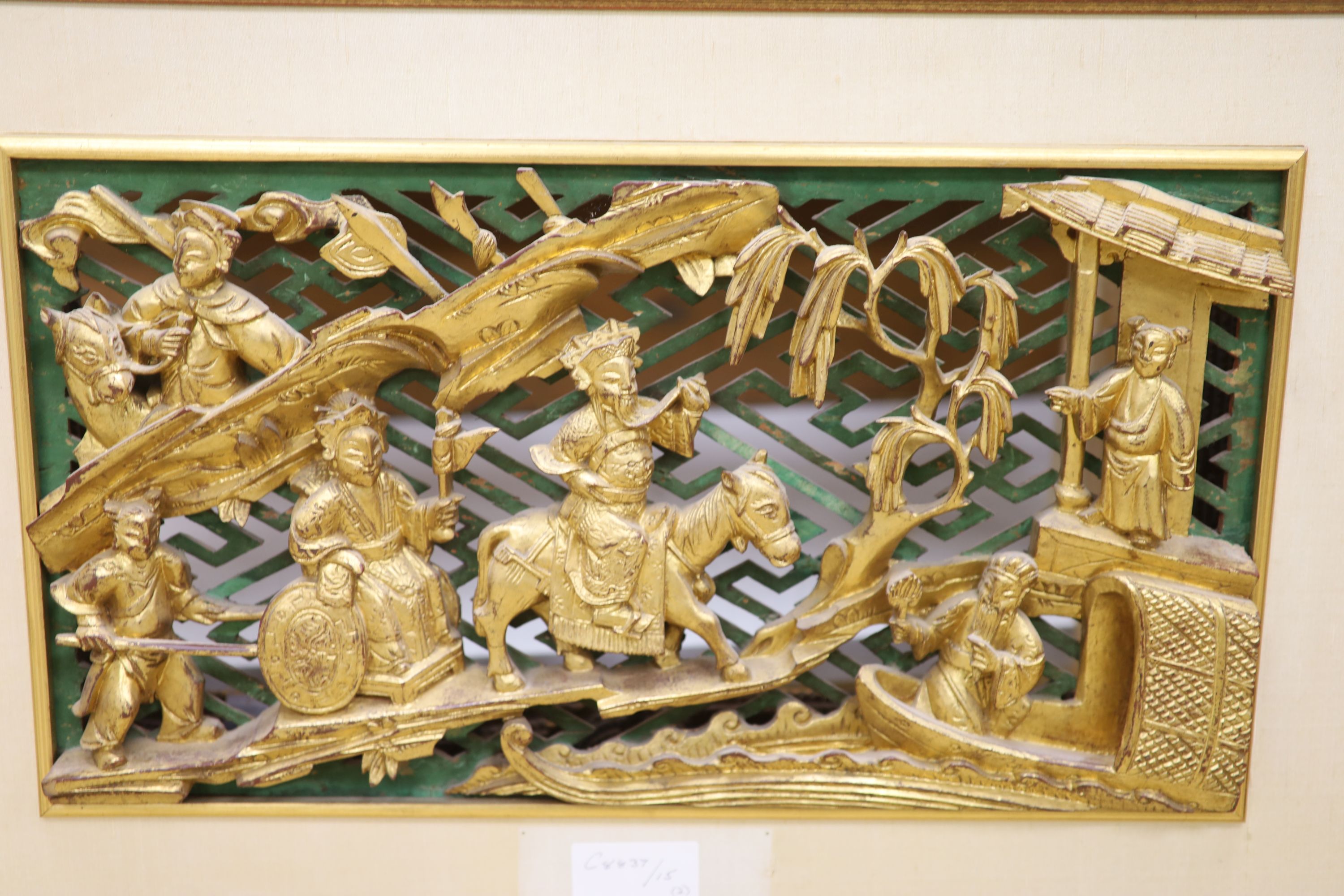An Oriental carved giltwood picture and a carved wood picture frame